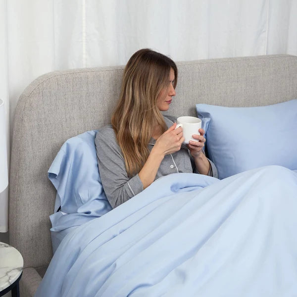 model with Serene_Blue_bedsheet
